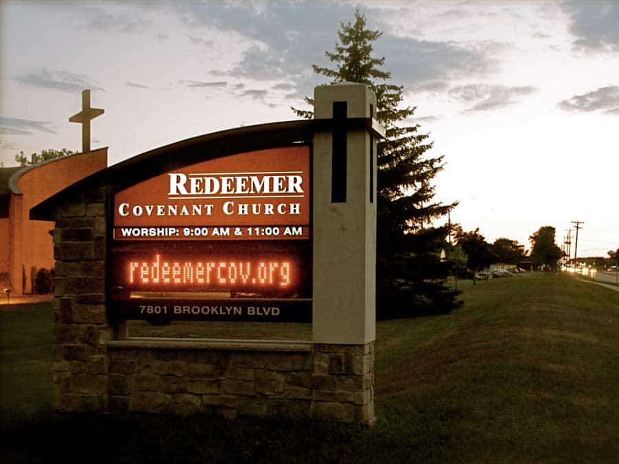 Welcome to Redeemer church sign with cross