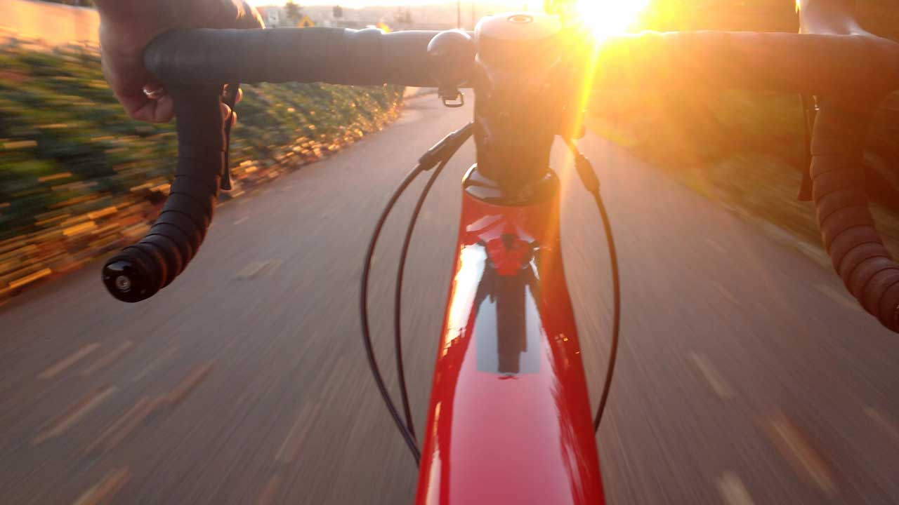 farewell biking into sunset